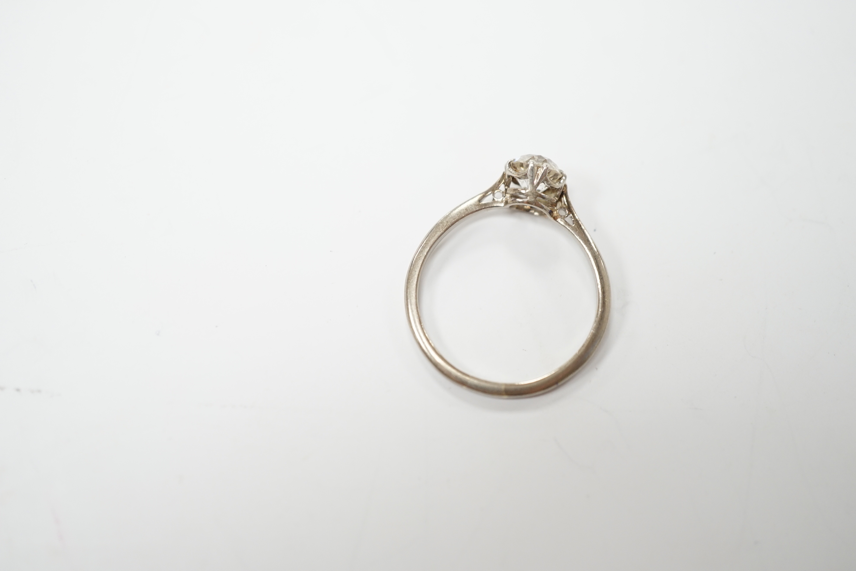 A white metal and solitaire diamond set ring, size O/P, gross weight 2.4 grams